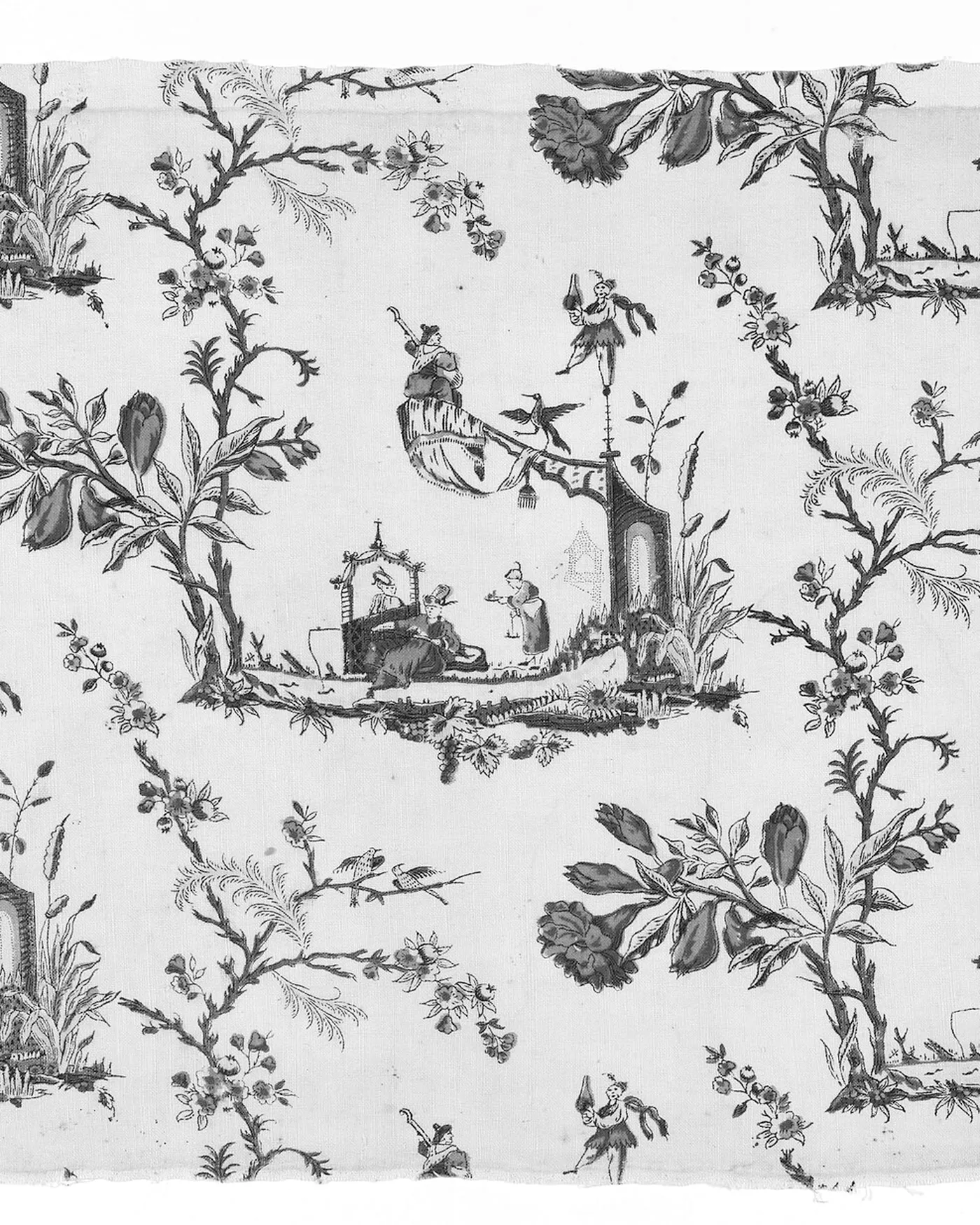 A length of eighteenth-century printed cotton showing a repeat floral and figure motif.