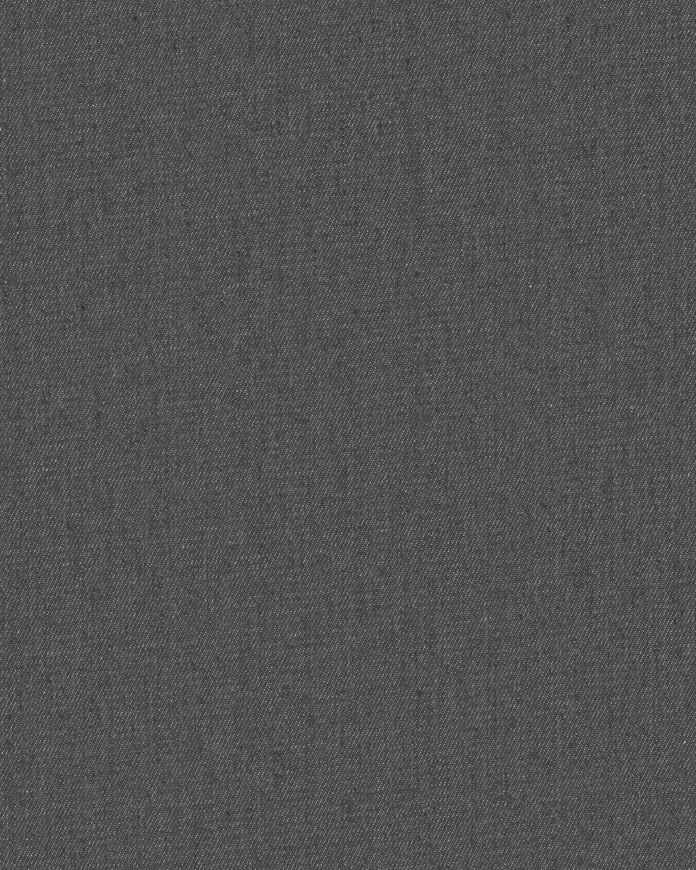 A close view of denim, the twill weave filling the frame.
